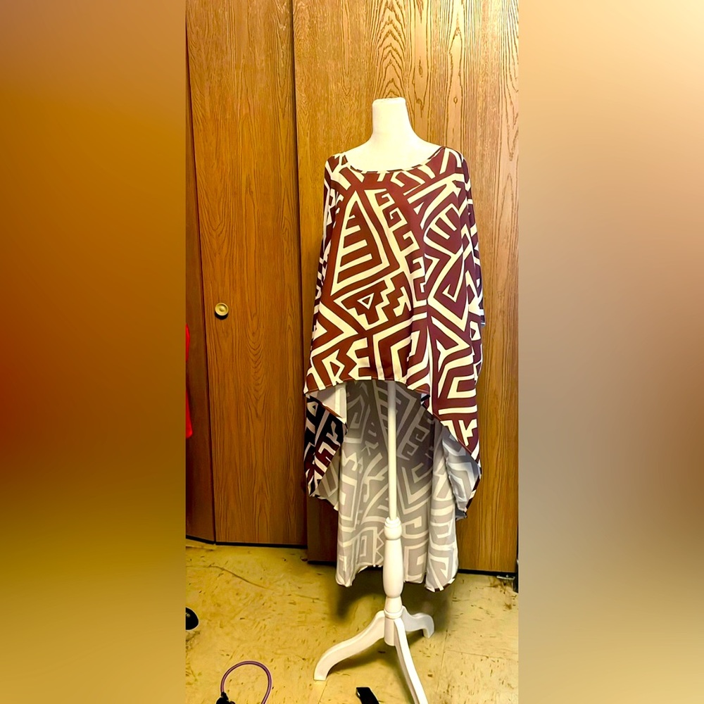 Beautiful, lightweight. 100% polyester hi low top in brown and white.